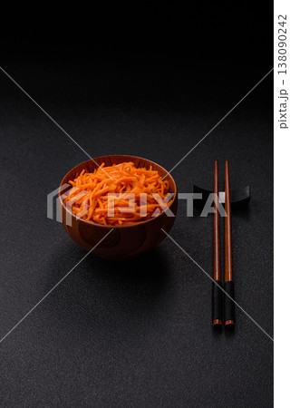 Spicy Korean carrot salad, grated with salt and spices, an Asian dish. Korean carrots 138090242
