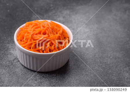 Spicy Korean carrot salad, grated with salt and spices, an Asian dish. Korean carrots 138090249