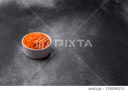 Spicy Korean carrot salad, grated with salt and spices, an Asian dish. Korean carrots 138090251