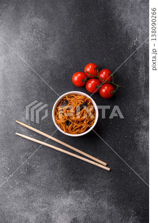 Yakisoba, Asian noodles with vegetables and meat, is a Japanese spicy food. Yakisoba or udon Yakisoba, Asian noodles with vegetables and meat, is a Japanese spicy food. Yakisoba or udon 138090266