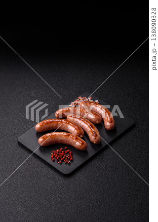 Grilled pork or chicken sausages, smoked fried food with salt and spices. Grilled sausages Grilled pork or chicken sausages, smoked fried food with salt and spices. Grilled sausages 138090328