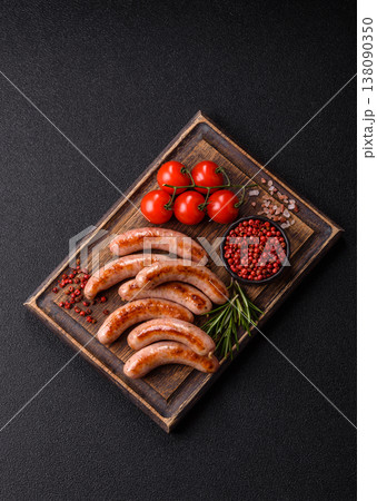 Grilled pork or chicken sausages, smoked fried food with salt and spices. Grilled sausages 138090350
