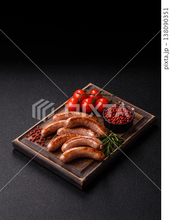 Grilled pork or chicken sausages, smoked fried food with salt and spices. Grilled sausages Grilled pork or chicken sausages, smoked fried food with salt and spices. Grilled sausages 138090351
