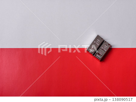 A silver bar, white metal against a backdrop of Polish flag, as a concept. A silver bar A silver bar, white metal against a backdrop of Polish flag, as a concept. A silver bar 138090517