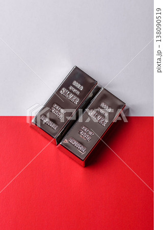 A silver bar, white metal against a backdrop of Polish flag, as a concept. A silver bar A silver bar, white metal against a backdrop of Polish flag, as a concept. A silver bar 138090519