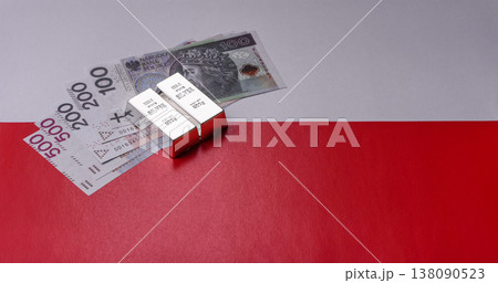 A silver bar, white metal against a backdrop of Polish flag, as a concept. A silver bar 138090523