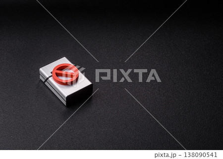 A metal cigarette box with a no smoking sign depicts a harmful habit. A cigarette box A metal cigarette box with a no smoking sign depicts a harmful habit. A cigarette box 138090541