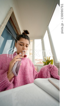 Woman Practices Voice. Young Woman Inhales To Prepare Her Voice For Upcoming Live Broadcast At Window Desk Woman Practices Voice. Young Woman Inhales To Prepare Her Voice For Upcoming Live Broadcast At Window Desk 138090781