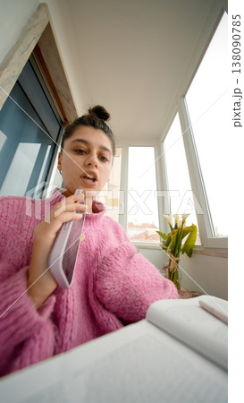Woman Performs Vocals At Home. Casual Female Performer Shares Intimate Singing Session With Microphone Woman Performs Vocals At Home. Casual Female Performer Shares Intimate Singing Session With Microphone 138090785