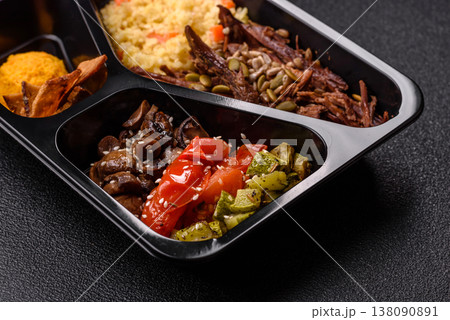 A bowl with beef, porridge, mushrooms, vegetables, sauce, and spices. Beef bowl A bowl with beef, porridge, mushrooms, vegetables, sauce, and spices. Beef bowl 138090891