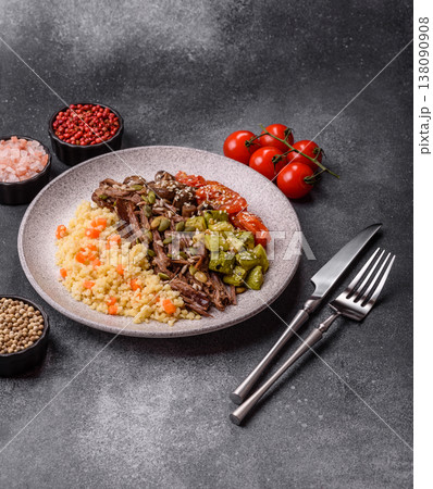 A bowl with beef, porridge, mushrooms, vegetables, sauce, and spices. Beef bowl A bowl with beef, porridge, mushrooms, vegetables, sauce, and spices. Beef bowl 138090908