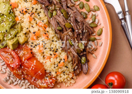 A bowl with beef, porridge, mushrooms, vegetables, sauce, and spices. Beef bowl 138090918