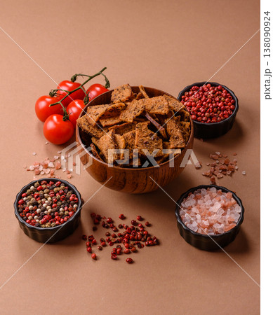 Croutons or crackers made from rye bread with garlic, salt, and spices. Croutons with salt 138090924