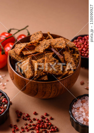 Croutons or crackers made from rye bread with garlic, salt, and spices. Croutons with salt Croutons or crackers made from rye bread with garlic, salt, and spices. Croutons with salt 138090927