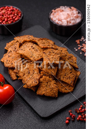 Croutons or crackers made from rye bread with garlic, salt, and spices. Croutons with salt Croutons or crackers made from rye bread with garlic, salt, and spices. Croutons with salt 138090942