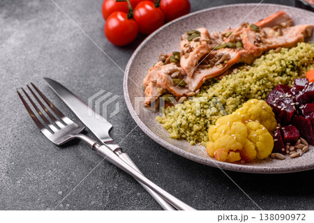 A bowl with chicken or turkey, porridge, vegetables, sauce, and spices. A meat bowl A bowl with chicken or turkey, porridge, vegetables, sauce, and spices. A meat bowl 138090972