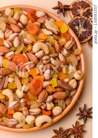 A mix of nuts and dried fruits as ingredients for a healthy meal. Nuts and dried fruits A mix of nuts and dried fruits as ingredients for a healthy meal. Nuts and dried fruits 138091507