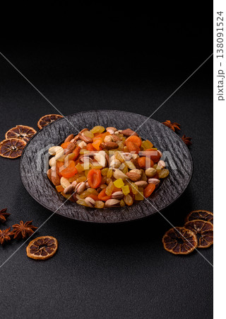 A mix of nuts and dried fruits as ingredients for a healthy meal. Nuts and dried fruits 138091524