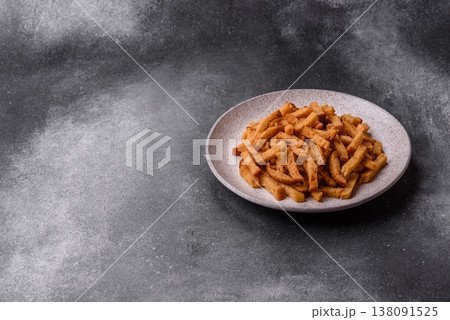 Croutons or crackers made from rye bread with garlic, salt, and spices. Croutons with salt Croutons or crackers made from rye bread with garlic, salt, and spices. Croutons with salt 138091525