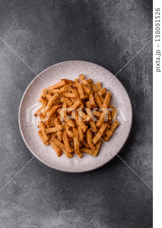 Croutons or crackers made from rye bread with garlic, salt, and spices. Croutons with salt Croutons or crackers made from rye bread with garlic, salt, and spices. Croutons with salt 138091526