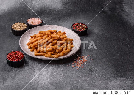 Croutons or crackers made from rye bread with garlic, salt, and spices. Croutons with salt Croutons or crackers made from rye bread with garlic, salt, and spices. Croutons with salt 138091534