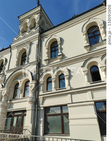 A historic building with ornate arched windows, detailed columns, and decorative reliefs, set under a bright blue sky. The intricate craftsmanship highlights classical architectural mastery. A historic building with ornate arched windows, detailed columns, and decorative reliefs, set under a bright blue sky. The intricate craftsmanship highlights classical architectural mastery. 138091608