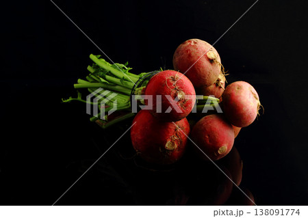 large bunch of fresh radish. Black background. Top view large bunch of fresh radish. Black background. Top view 138091774