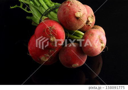 large bunch of fresh radish. Black background. Top view large bunch of fresh radish. Black background. Top view 138091775