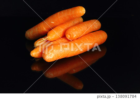 young carrots isolated on black background, cooking fresh vegetables concept young carrots isolated on black background, cooking fresh vegetables concept 138091784