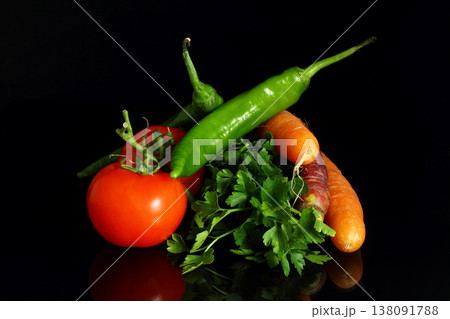Isolated peppers and juicy cherry tomatoes. black backgorund. Isolated peppers and juicy cherry tomatoes. black backgorund. 138091788