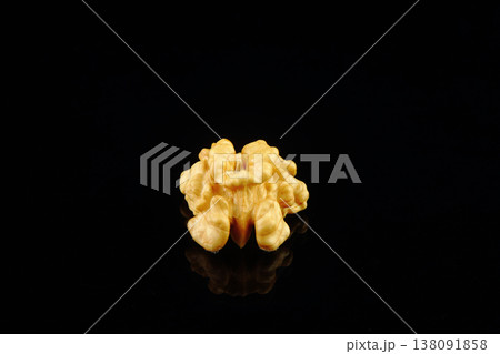 Walnuts with yellow autumn leaves isolated on black background Walnuts with yellow autumn leaves isolated on black background 138091858