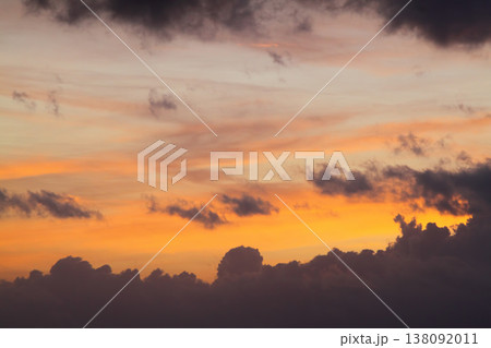 Blurry background of red sunset sky. Dramatic sky with colorful cloud background. Red burning sunset sky. Copy space. 138092011