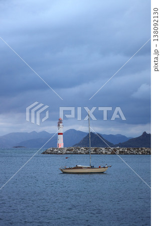 A sailing boat sailing in a stormy weather in Bodrum's Turgutreis district. A sailing boat sailing in a stormy weather in Bodrum's Turgutreis district. 138092130