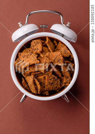 Croutons or crackers made from rye bread with garlic, salt, and spices. Croutons with salt Croutons or crackers made from rye bread with garlic, salt, and spices. Croutons with salt 138092185