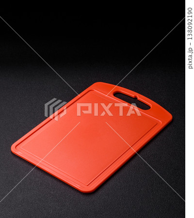 An empty plastic cutting board as a kitchen utensil. An empty plastic cutting board An empty plastic cutting board as a kitchen utensil. An empty plastic cutting board 138092190