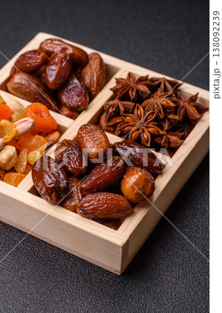 Dried dates on a ceramic plate for Ramadan or Iftar. Dates fruit as a background Dried dates on a ceramic plate for Ramadan or Iftar. Dates fruit as a background 138092239
