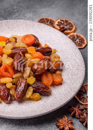 Dried apricots, raisins, and candied fruits as ingredients for baked goods and sweets. Dried fruits 138092261