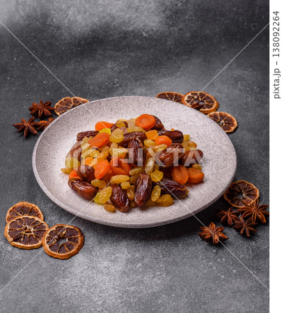 Dried apricots, raisins, and candied fruits as ingredients for baked goods and sweets. Dried fruits Dried apricots, raisins, and candied fruits as ingredients for baked goods and sweets. Dried fruits 138092264