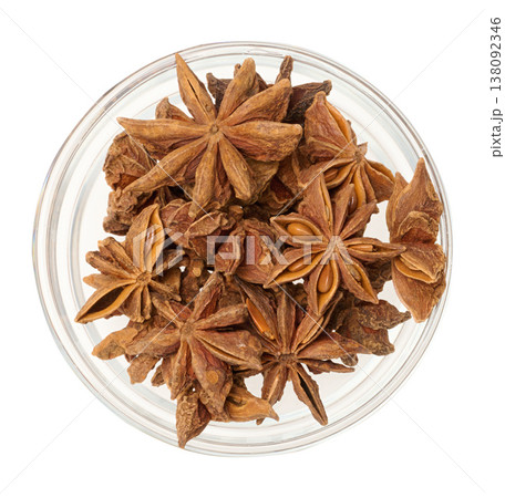 Dried star anise in a glass transparent bowl on an isolated background 138092346