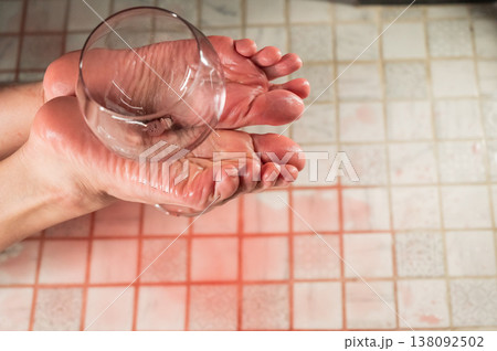 Foot fetish. A woman holds a wine glass in the shower. 138092502