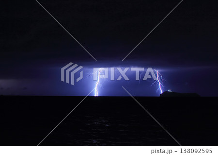 Dangerous storm of lightning and lightning in the clouds that touch the ground Dangerous storm of lightning and lightning in the clouds that touch the ground 138092595