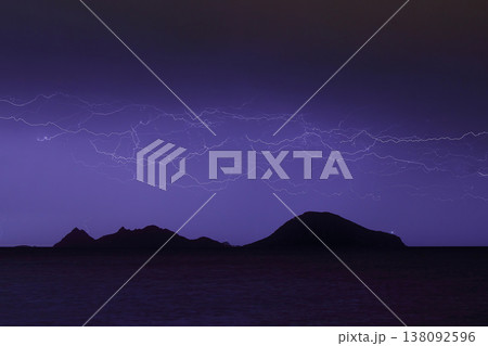 Dangerous storm of lightning and lightning in the clouds that touch the ground Dangerous storm of lightning and lightning in the clouds that touch the ground 138092596