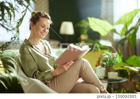 Relaxed Woman Enjoying Mindful Reading in an Urban Jungle Relaxed Woman Enjoying Mindful Reading in an Urban Jungle 138092885