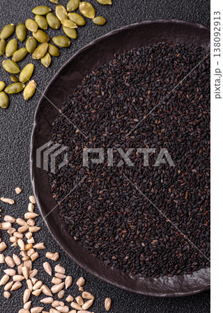 Black sesame seeds in a bowl, an ingredient for oil and healthy eating. Black sesame Black sesame seeds in a bowl, an ingredient for oil and healthy eating. Black sesame 138092913
