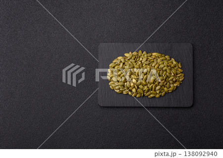 Shelled pumpkin seed kernels, salted, roasted, or raw, are a healthy ingredient. Pumpkin seeds Shelled pumpkin seed kernels, salted, roasted, or raw, are a healthy ingredient. Pumpkin seeds 138092940