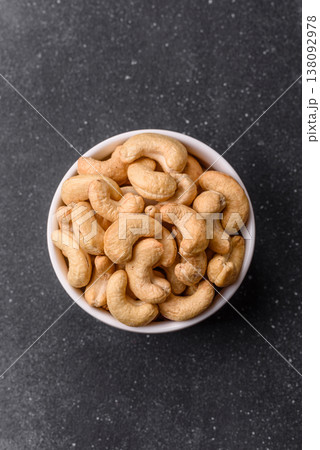 Roasted or raw cashew make a savory snack for a healthy, filling meal. Cashew nuts Roasted or raw cashew make a savory snack for a healthy, filling meal. Cashew nuts 138092978