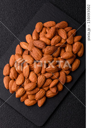 Raw and peeled almonds as a healthy food ingredient. Almonds as a food background 138093002