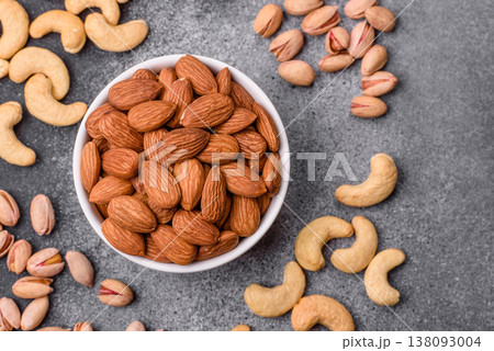 Raw and peeled almonds as a healthy food ingredient. Almonds as a food background 138093004