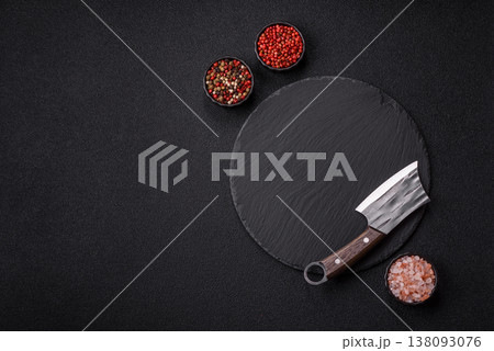 An empty slate cutting board with cutlery on a kitchen counter. Slate cutting board An empty slate cutting board with cutlery on a kitchen counter. Slate cutting board 138093076