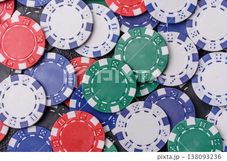 Multicolored casino chips as a conceptual backdrop for poker, blackjack. Multicolored casino chips 138093236